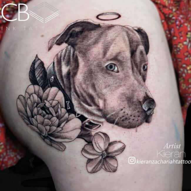 Kieran Tattoo Artist Realism Neo Traditional Black and Grey Dog with Halo and Roses Thigh Tattoo