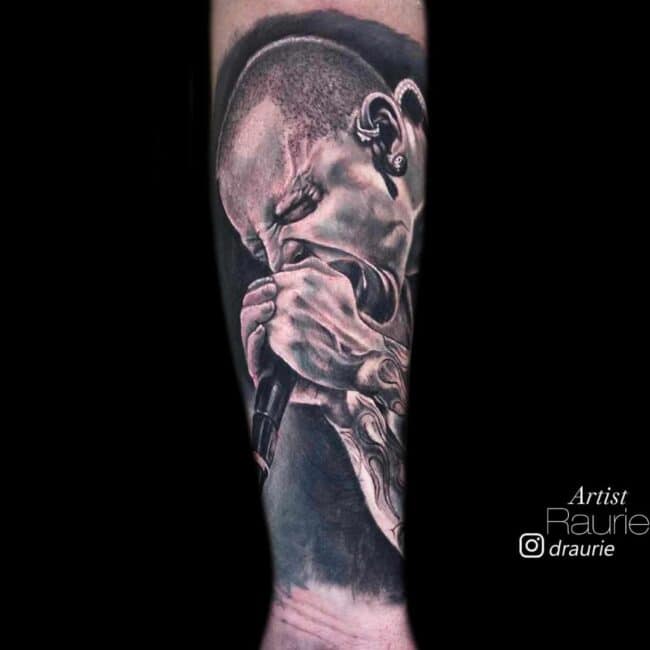 Raurie Tattoo Artist Linkin Park Chester Bennington Singing to a Microphone Black and White Realism Forearm Tattoo