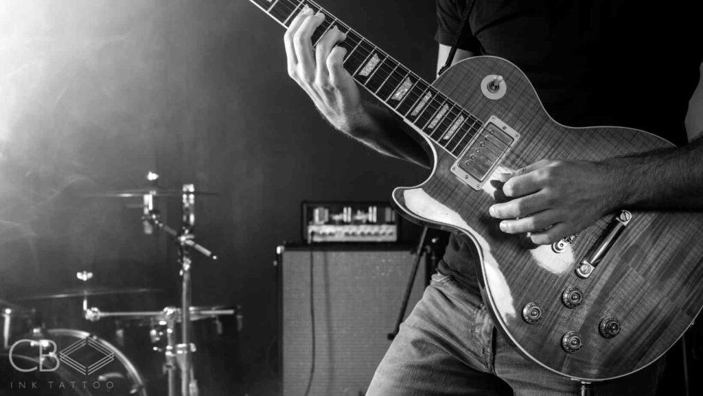 The Timeless Appeal of Music Tattoos Black and White Guitar Blog Cover Image