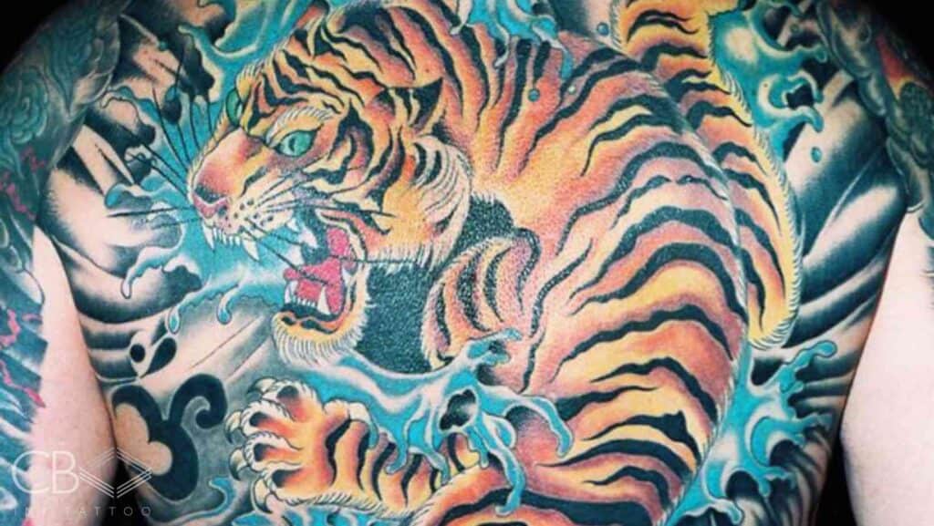 Brisbane’s Best Back Tattoos Stunning Ink Trends for 2025 Traditional Colour Tiger with Water Elements Around It Full Back Tattoo Blog Cover Image