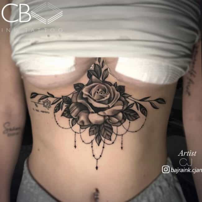 CJ Tattoo Artist Mandala Geometric Realism Detailed Rose Surrounded by Leaves Resembling Mandala Design Sternum Tattoo