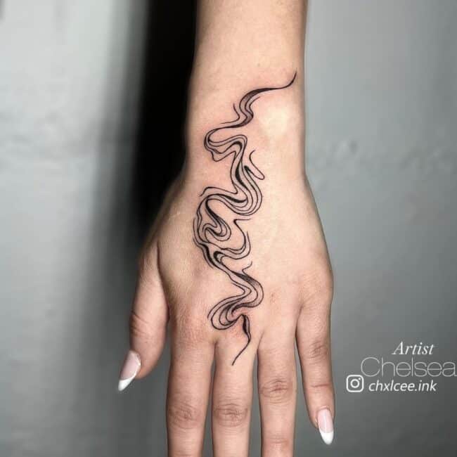 Chelsea Tattoo Artist Fine Line Black and Grey Abstract Lines Smoke Like Element Hand Tattoo