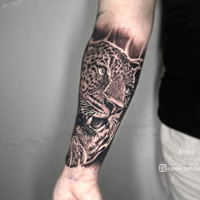 Corey Tattoo Artist Realism Black and Grey Jaguar Head With Open Mouth Sharp Teeth Full Forearm Tattoo