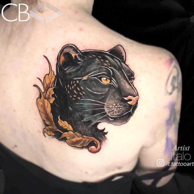 Italo Tattoo Artist Colour Jaguar Head Closed Mouth Black Fur Yellow Eyes Leaf Divider on Neck Back Shoulder Tattoo