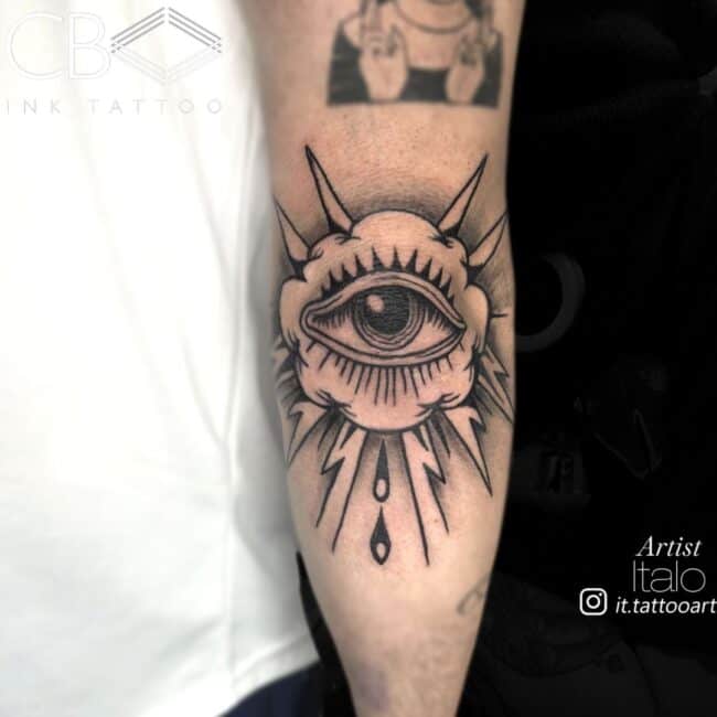 Italo Tattoo Artist Traditional Black and Grey All Seeing Eye with Lightning Patterns Cloud Rain Drops Elbow Tattoo