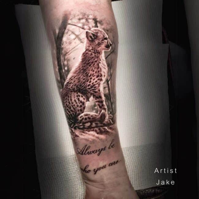 Jake Tattoo Artist Realism Colour Cheetah Cub Sitting in the Woods Portrait Forearm Tattoo