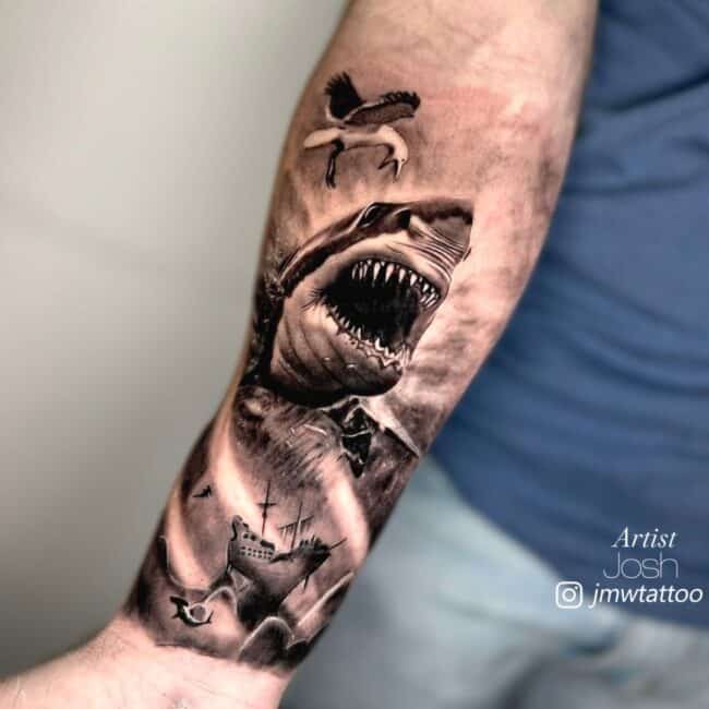 Josh Tattoo Artist Realism Black and Grey Attacking Shark Seagull Sea Ocean Ship Waves Storm Full Forearm Tattoo