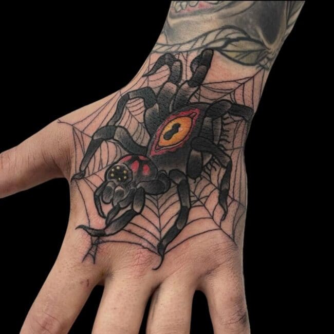 Rhys Tattoo Artist Neo Traditional Colour Detailed Tarantula With Markings On Abdomen Web Hand Tattoo