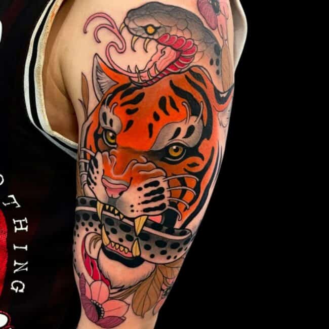 Rhys Tattoo Artist Neo Traditional Japanese Colour Tiger and Snake Locked in Fight Flowers Leaves Arm Sleeve Tattoo