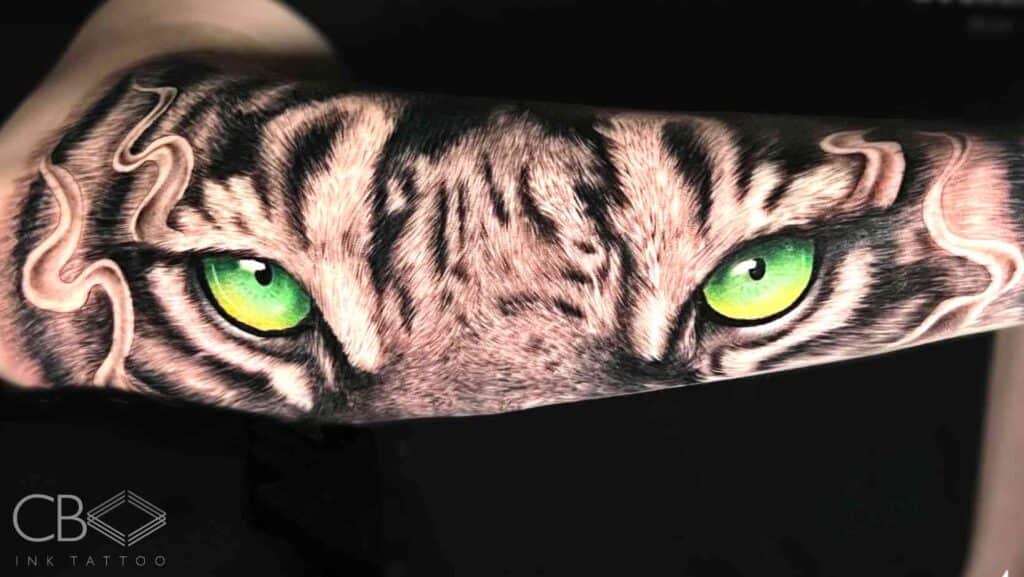 Wildlife Tattoos Taking Over Brisbane in 2025 Erick Tattoo Artist Realism Tiger Green Brigth Eyes Full Forearm Tattoo Blog Cover Image
