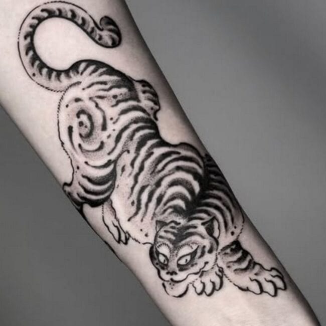 Blackwork Tattoo of a Full Body Tiger Strength Surivival with Detailed Tail and Body Forearm Tattoo
