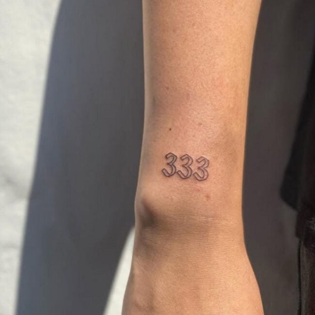 Minimalist Script Lettering Numbers 333 Wrist Tattoo