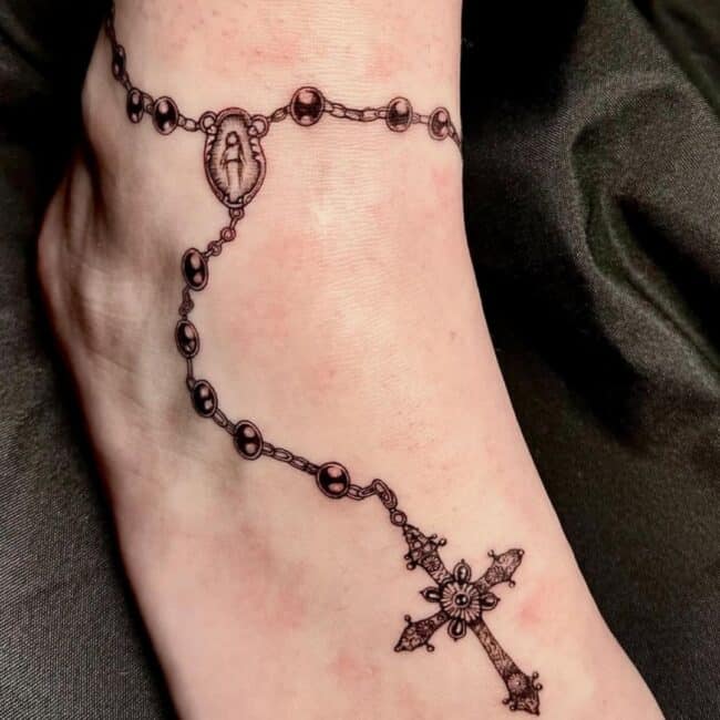 Black and Grey Realism Rosary Cross Beads Chain Detailed Cross Ankle Foot Tattoo