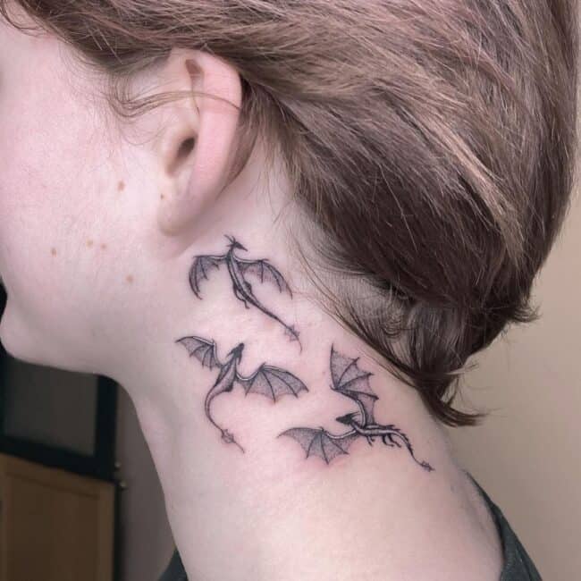 Black and Grey Traditional Minimalist Full Body Dragons Detailed Wings Tails Head Sharp Spines Horns Neck Tattoo