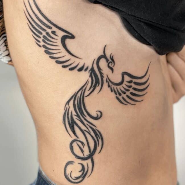 Blackwork Tribal Whole Body Phoenix Pointed Beak Crest Outstretched Wings Tail Feathers Torso Rib Waist Tattoo