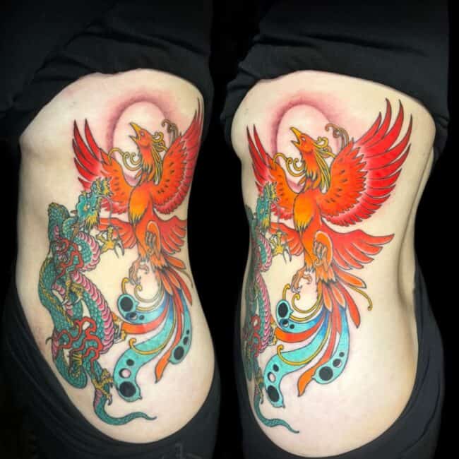 Colour Japanese Cartoon Full Body Irezumi Phoenix Dragon Pointed Beak Glowing Eye Crest Wings Tail Sharp Talons Nails Sharp Claws Paws Horns Scales Spine Side Torso Rib Waist Tattoo