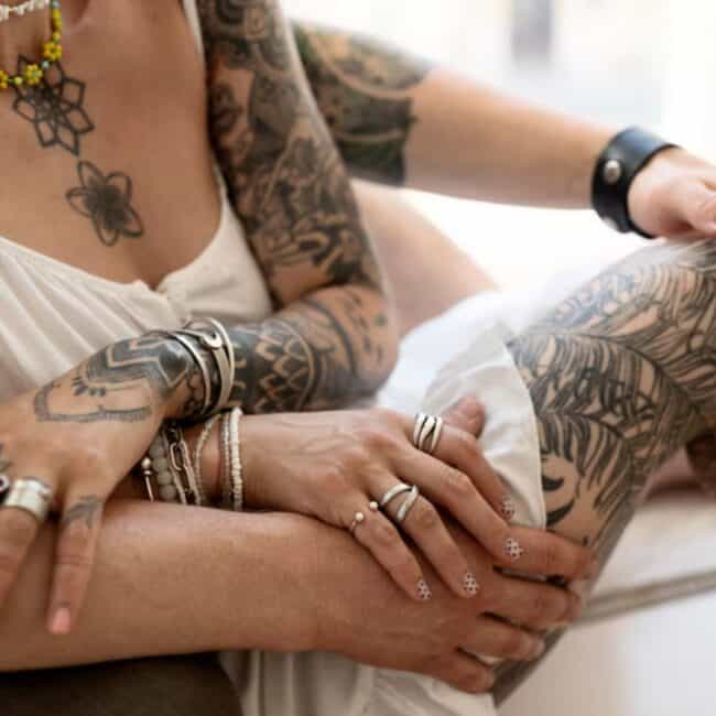 Mandala Geometric Black and Grey Couple Clingy Holding Hands With Rings Flower Necklaces Leather Bracelet White Dress Leaves Stars Shoulder Arm Sleeve Leg Tattoo