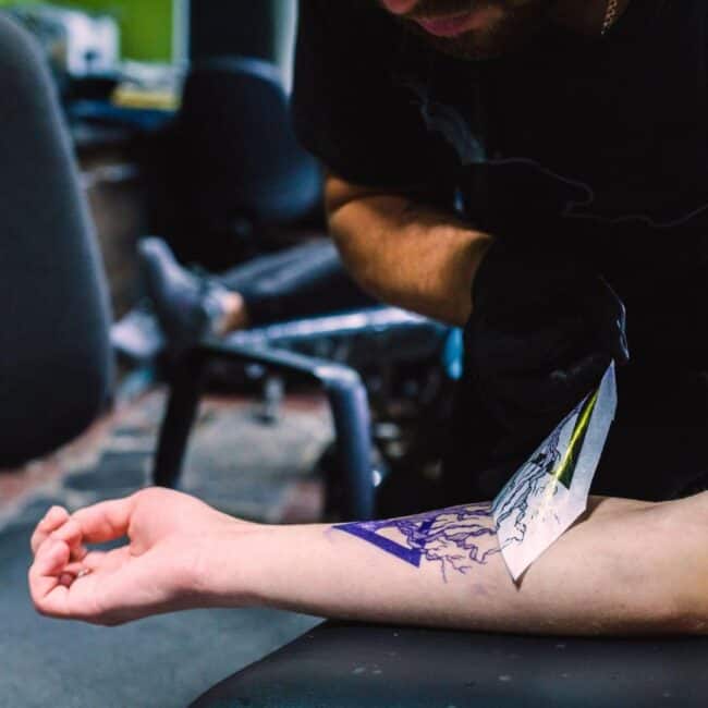Realism Black and Grey Triangular Shape with Tree Silhouette Without Leaves Stencil Paper Removing from Skin Gloves Forearm Tattoo