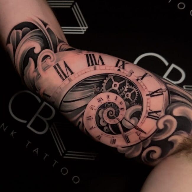 Sunny Tattoo Artist Black and Grey Realism Spiral Clock Face Roman Numerals Inner Gears Dial Hour Markers Clock Hands Forearm Arm Tattoo