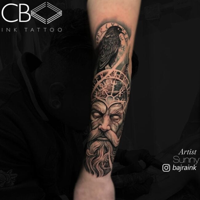 Sunny Tattoo Artist Realism Portrait Odin Tattoo with Runes Ancient Alphabet Symbols Raven Black Bird Fierce Eyes Beard Mustache Forearm Arm Tattoo