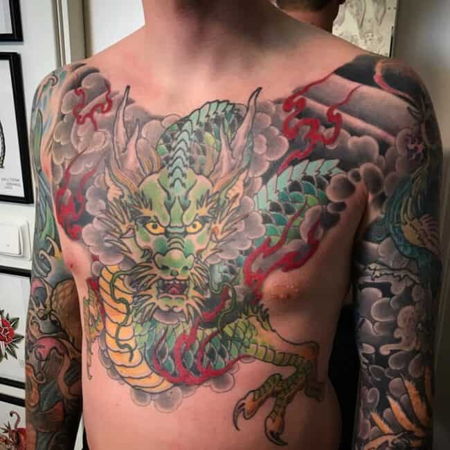 Traditional Japanese Colour Full Body Dragon Sharp Claws Paws Teeth Horns Scales Detailed Eyes Nose Mouth Burning Flames Wave Pattern Arm Sleeve Chest Tattoo