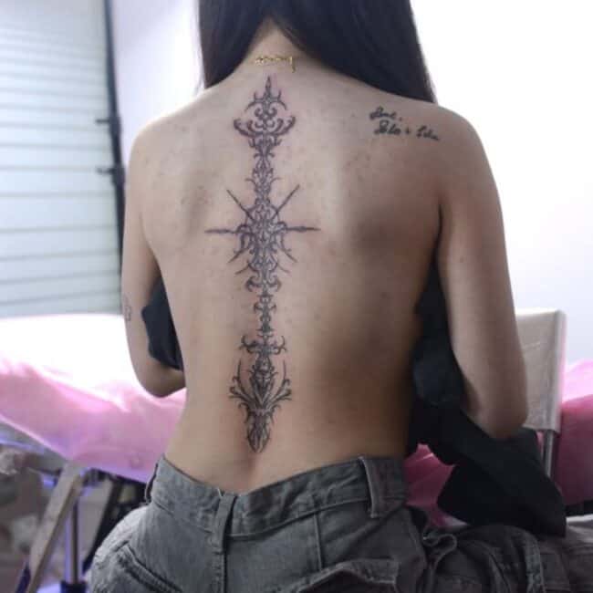 Black and Grey Tribal Geometric Vertical Sharp Arrow Striking Edges Elements Spine Back Tattoo