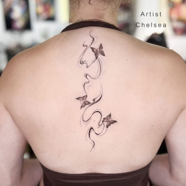 Chelsea Tattoo Artist Black and Grey Realism Butterflies Vertical Wave Lines Forewings Tails Antennae Heads Spine Back Tattoo
